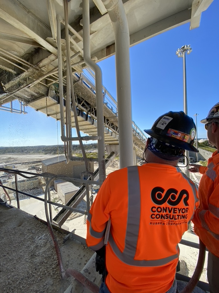 CCR Worker outside with conveyor belt