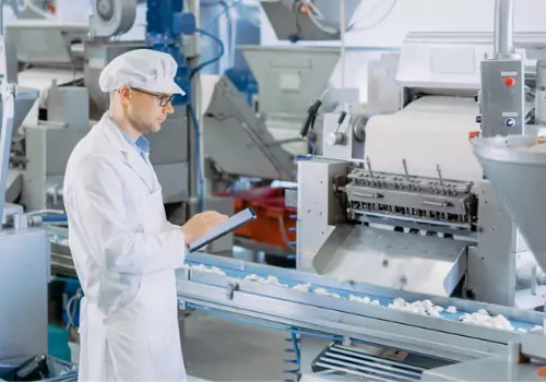 A man monitoring a conveyor system during Conveyor Belt Maintenance in Wesley Chapel, FL